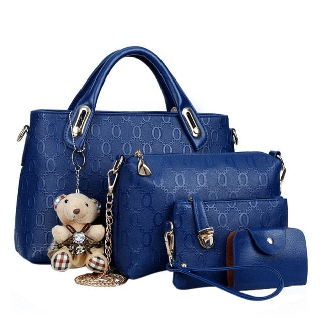 Bolso de mano de piel con cadena grabada